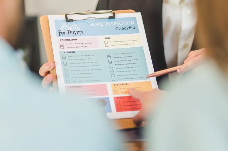Home inspection checklist on a clipboard